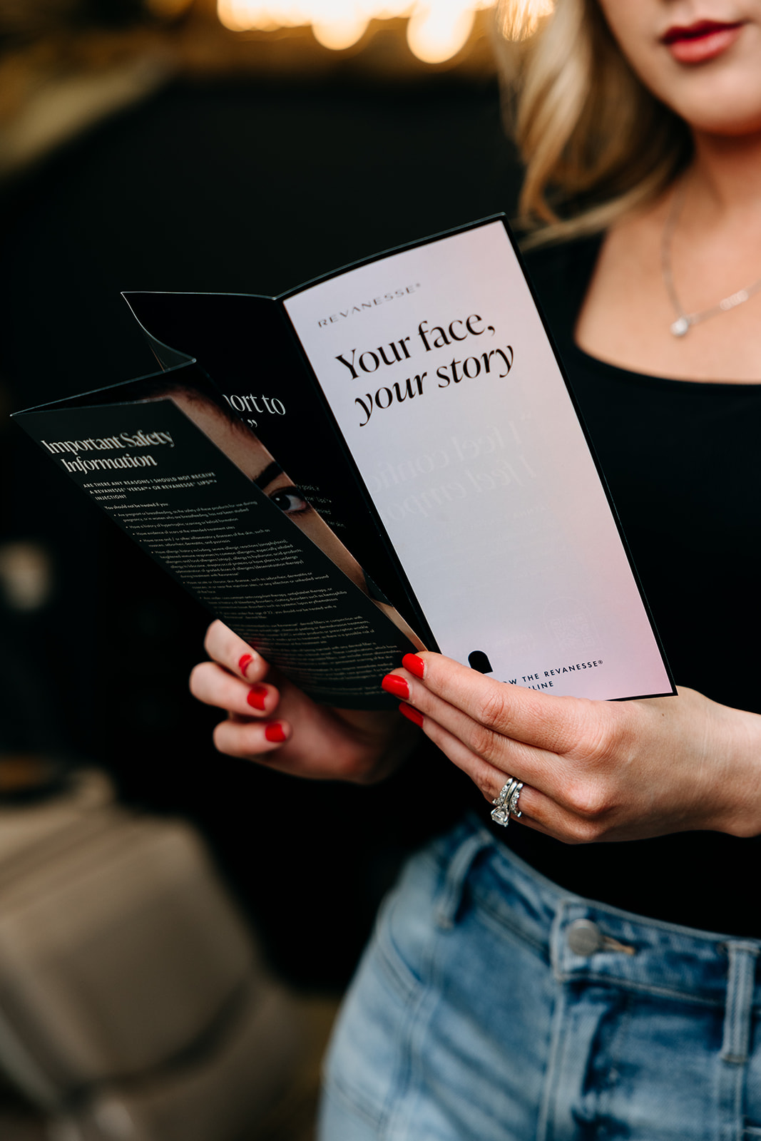 A person holding a pamphlet reading Your face, your story.