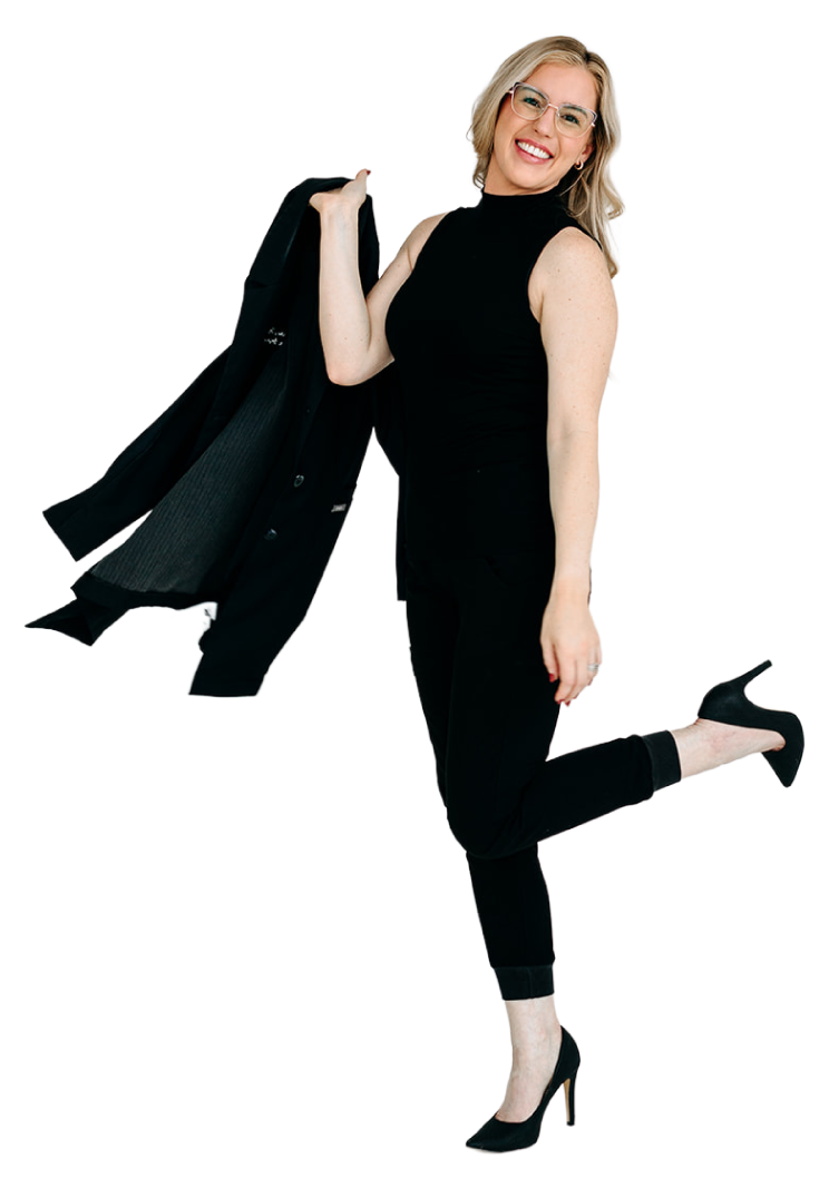 A woman in black attire lifting one leg, holding a jacket over her shoulder, smiling.
