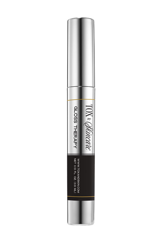 Tox & Alliantie Gloss Therapy, silver and black tube, cosmetic product packaging.