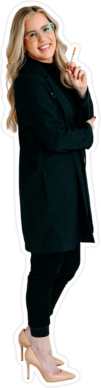 A woman in glasses holding a pen, wearing a black coat and heels, posing confidently.